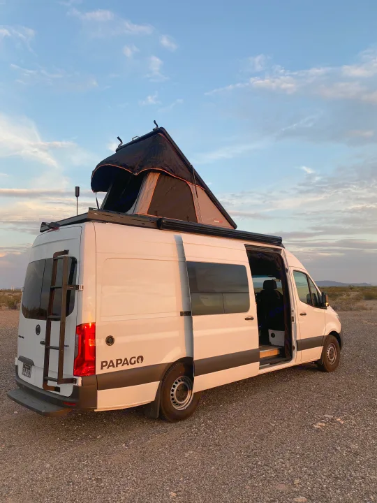White camper van with an open side. Mercedes-Benz Sprinter 2022