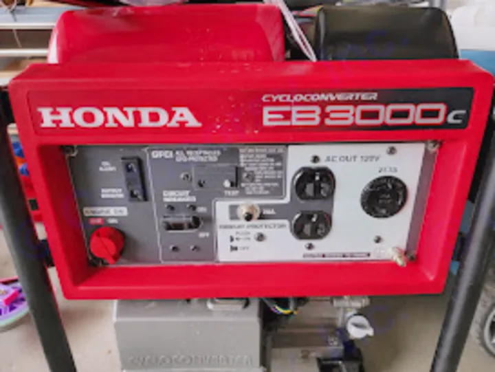 Red Honda EB3000C generator, great for RV rental adventures. Offers portable power from its control panel.. Forest River Wildwood FSX 2021