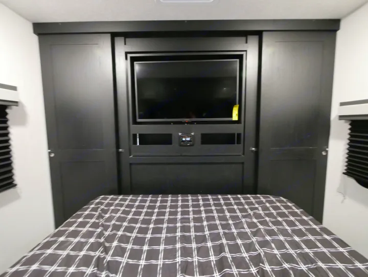 RV rental bedroom: Features built-in storage, TV, and a comfortable bed for a great journey.. Coachmen 257BHS 2022