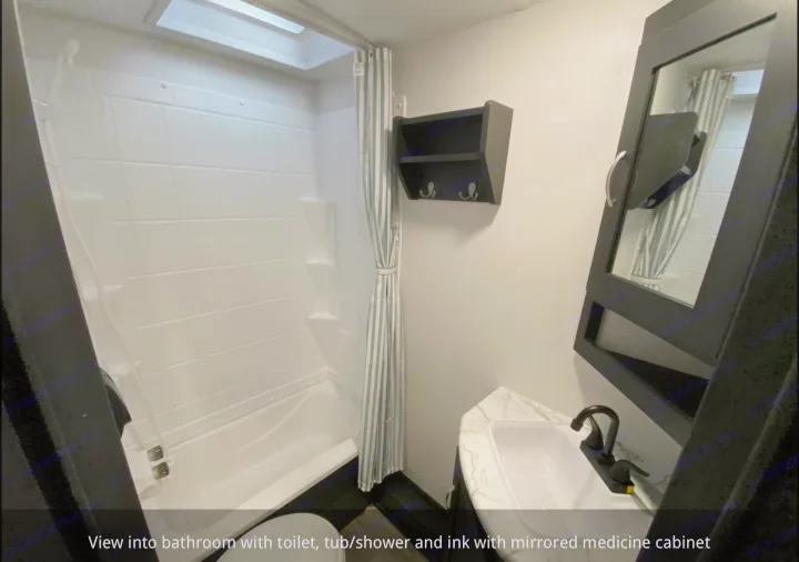 Well-equipped RV rental bathroom with tub/shower, sink, toilet, and mirrored medicine cabinet for your comfort.. Coachmen 257BHS 2022