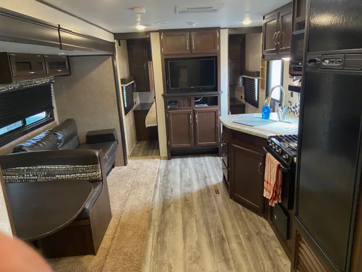 Spacious RV rental interior with kitchen, living area, and glimpse of bedroom. Perfect for your next adventure.. Jayco Jay Flight SLX 2018