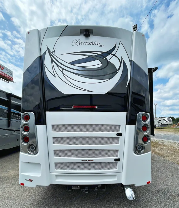 Rear view of a luxurious white and black Berkshire XLT motorhome, detailed for your next comfortable RV rental journey.. Berkshire XLT 2023