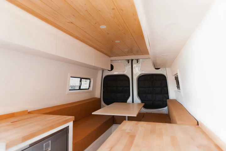 Step inside this modern RV rental! Bright interior with wood ceiling, dinette, tan seating, and ample storage.. Mercedes-Benz Sprinter 2014