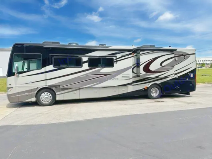Luxury black, gray, and white RV rental motorhome parked on asphalt. Ideal for spacious road trip adventures.. Phaeton Phaeton Motorhome 2011