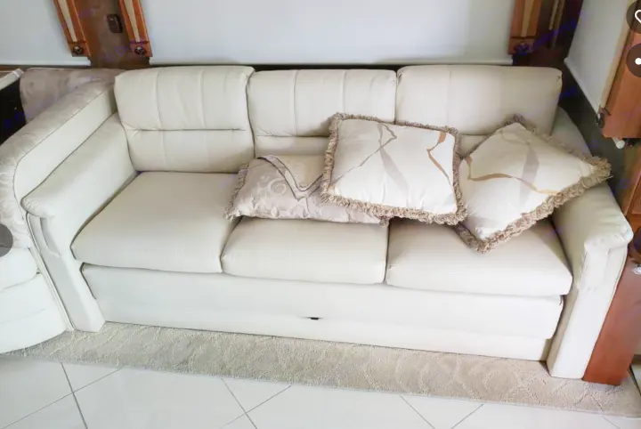 RV rental: Cream sofa with decorative pillows. Comfortable interior seating that doubles as a pull-out bed.. Phaeton Phaeton Motorhome 2011