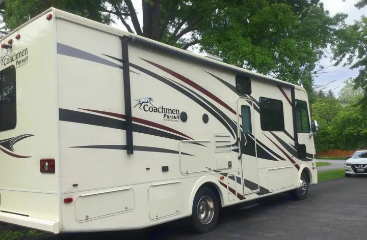 Coachmen Pursuit RV motorhome shown from side. Ideal RV rental for your next adventure.. Coachmen Pursuit 27DS 2019