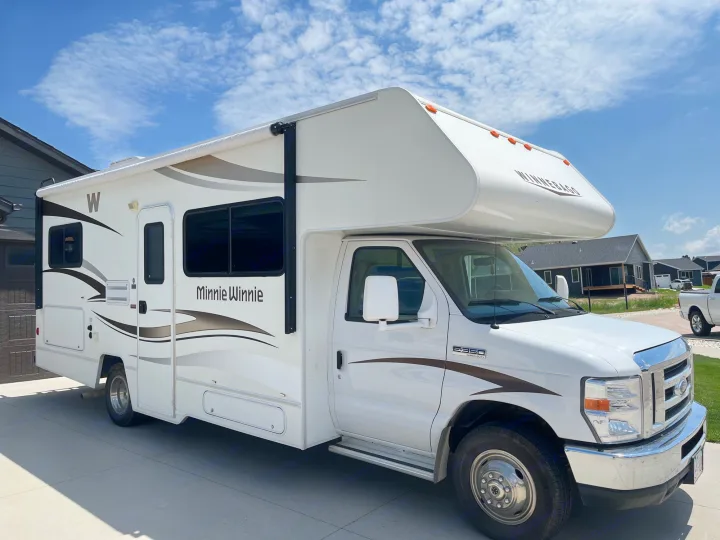 This white Winnebago Minnie Winnie RV is ready for your next adventure. Explore the possibilities of an RV rental!. Winnebago Minnie Winnie 2014