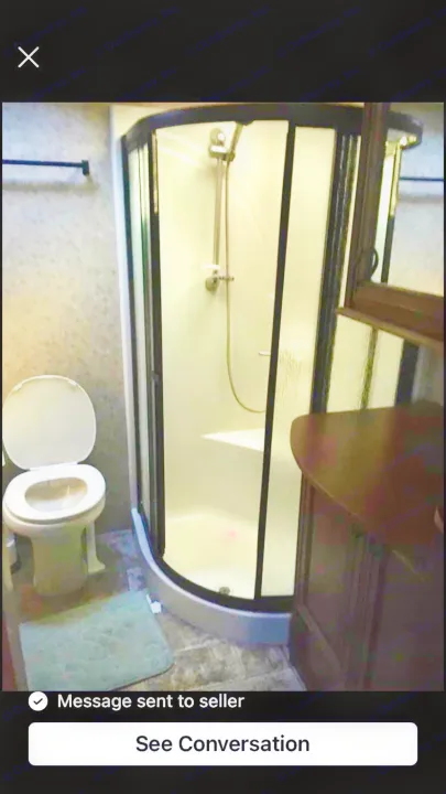 RV rental bathroom features: compact toilet, enclosed curved shower, and small vanity. Functional and clean interior.. Open Range RV Open Range RV Fifth Wheel 2013