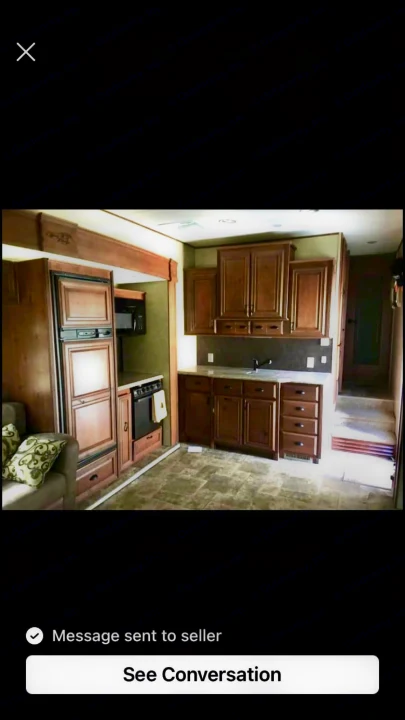 Inside our comfy RV rental: A fully equipped kitchen, living space, and warm wood finishes await your journey.. Open Range RV Open Range RV Fifth Wheel 2013