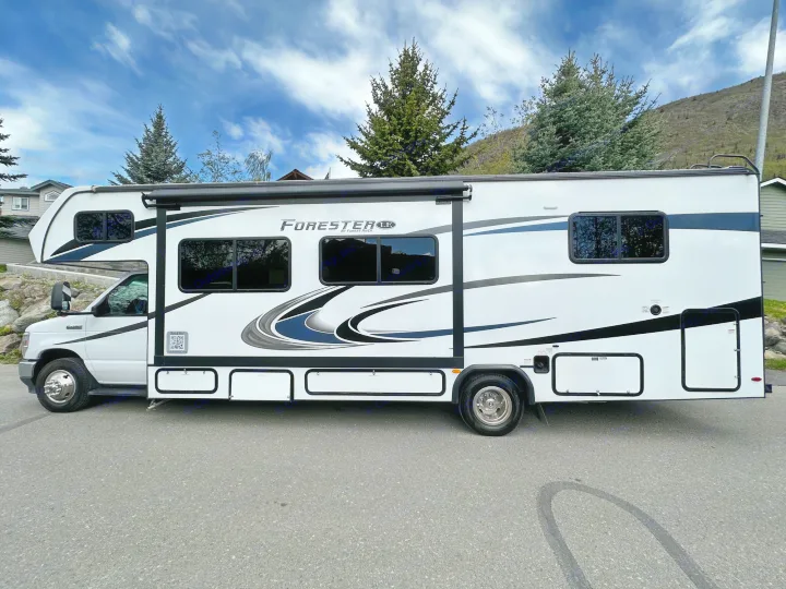 White Class C Forester RV rental parked outdoors, ready for travel adventures.. Forester LE 2022