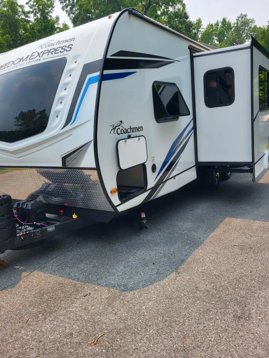 Front of a white Coachmen Freedom Express RV rental travel trailer.. Coachmen Freedom Express Ultra Lite 257BHS 2023