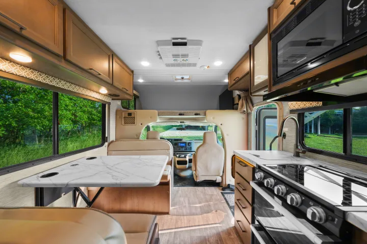 Step inside this inviting RV rental with a fully equipped kitchen, dining area, and cozy living space for your adventures.. Thor Coleman 2023