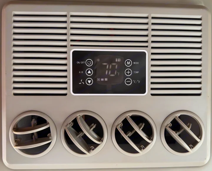 RV rental climate control unit with digital display showing 70°F, adjustable fan, and air vents for comfort.. Little Guy Little Guy Trailer 2013