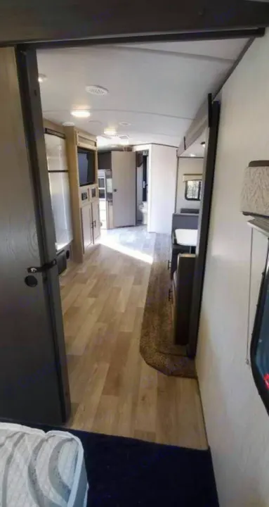 RV rental: Bright, open interior featuring a dinette, galley, and bath, ideal for comfortable travel.. Heartland RVs Sundance Ultra Lite 2021