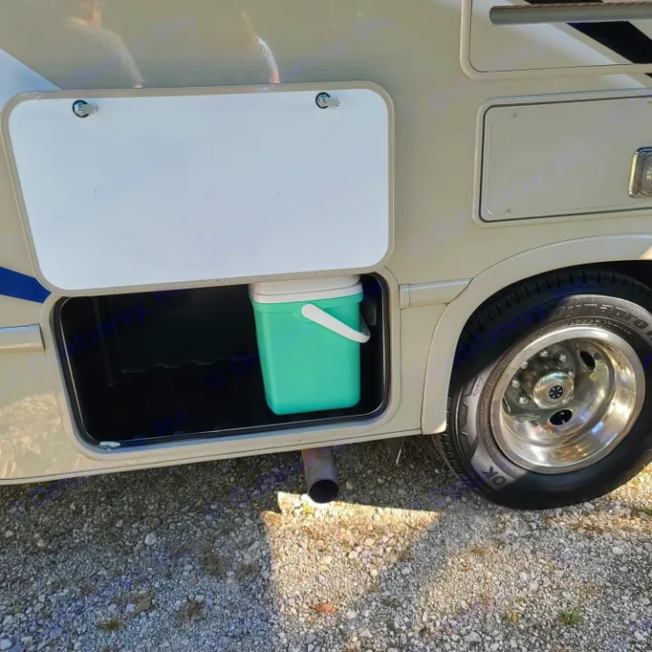 RV rental: Open exterior storage compartment reveals a teal cooler. Ideal for your next adventure!. Thor Motor Coach Chateau 2019