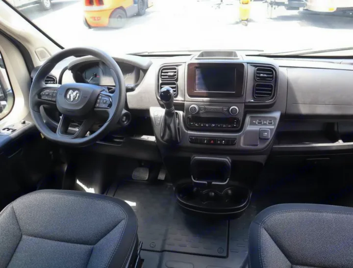 Ram ProMaster van interior, showcasing dashboard and steering wheel, ready for rv rental or conversion.. Thor Sequence 2021