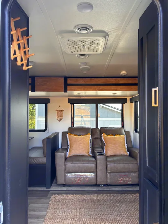 Step into this modern RV rental: Comfortable recliners, a dinette, and bright windows define this inviting travel space.. Keystone RV Outback Ultra-Lite 2022