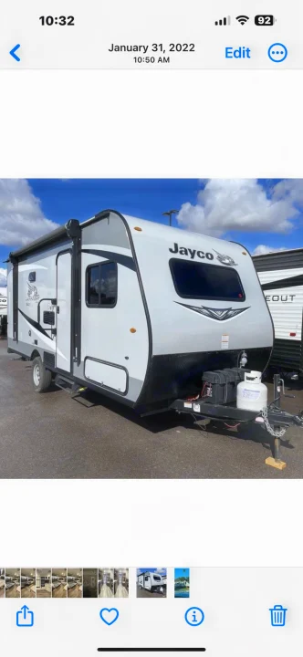 White and grey Jayco travel trailer parked outdoors, showcasing its exterior. Great option for RV rental.. Jayco Jay Flight 2021