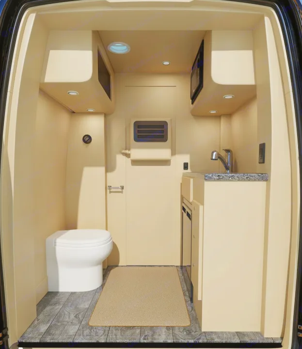 Compact RV rental interior with toilet, kitchenette (sink, microwave), and wood-look flooring. Perfect for travel.. Ultimate Toys Ultimate Coach 2024