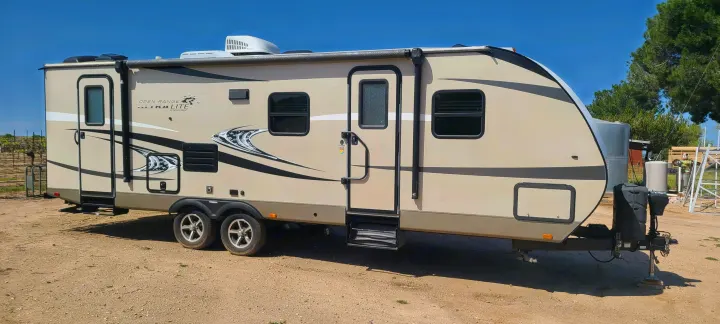 Experience outdoor adventures in this beige Open Range travel trailer, an ideal rv rental for your next getaway.. Highland Ridge RV Light 2017