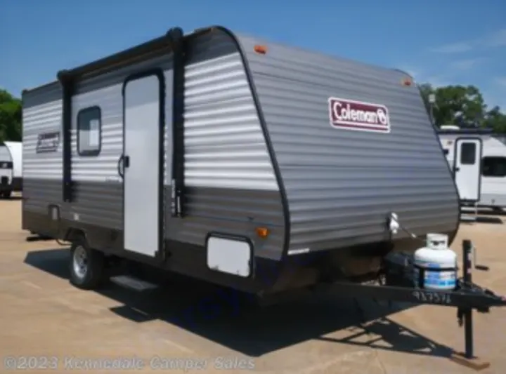 Grey Coleman travel trailer, ready for RV rental & camping adventures. Your portable living on wheels!. Dutchmen Coleman Lantern LT 2023