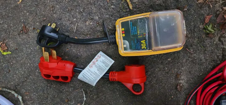RV rental essential: 30A RV electrical surge protector/analyzer & power adapters for safe hookup.. Thor Four Winds 2022
