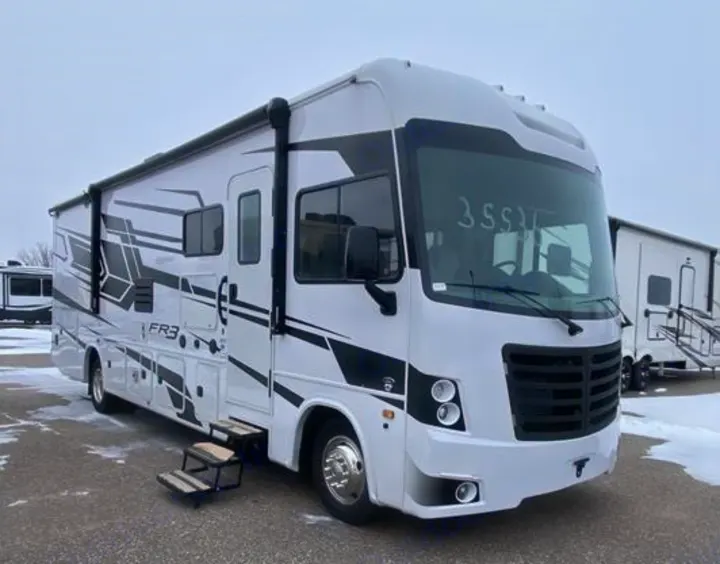 White FR3 motorhome rv rental, with bold black graphics & extended steps, is ready for your next adventure.. Forest River FR3 30DS 2023
