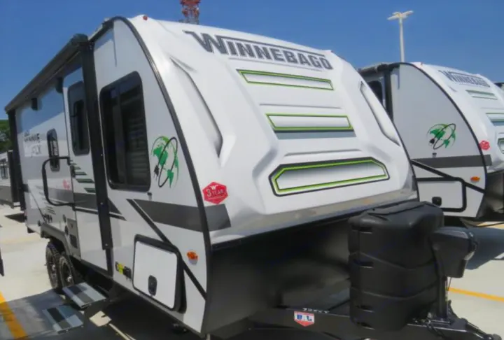 White Winnebago travel trailer, perfect for an RV rental adventure.. Winnebago Micro Minnie FLX 2100BH 2022
