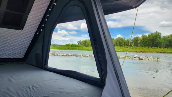 Relax inside this spacious tent, part of your RV rental adventure, with a serene river view and cozy lighting.. Toyota Highlander 2005