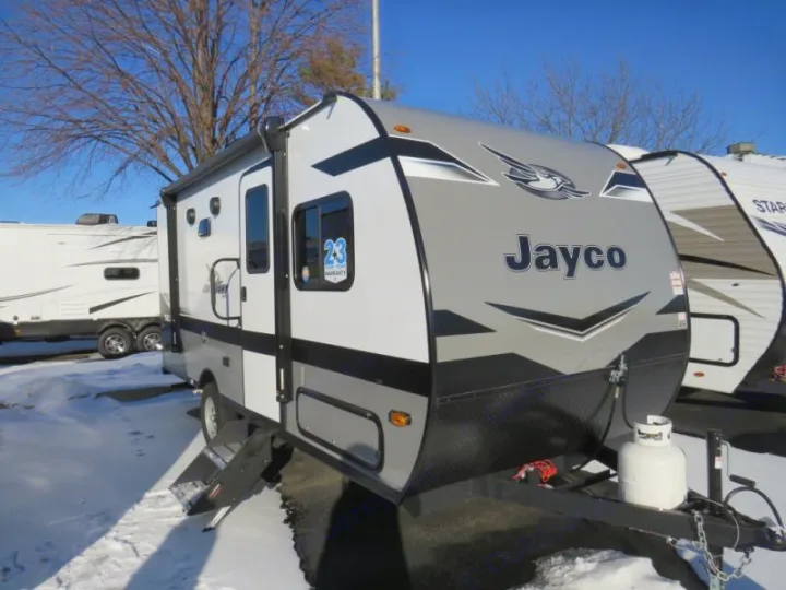 Grey Jayco travel trailer rv rental parked in snow, ready for adventure.. Jayco Jay Flight SLX STX Edition 2023