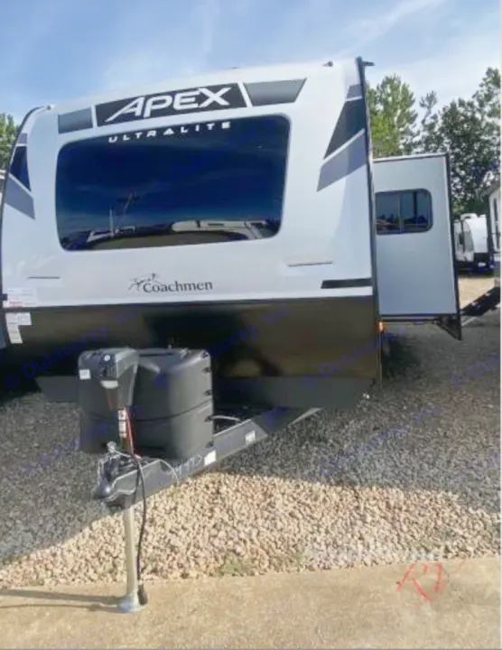 Front view of a white Apex Ultralite Coachmen RV for rental, parked on gravel with its hitch visible.. Coachmen Other 2022