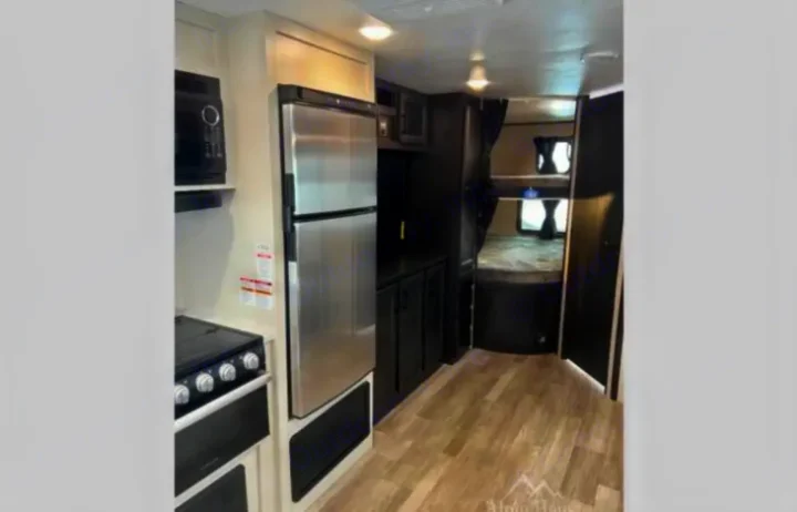 Explore this RV rental: modern interior with kitchen (fridge, stove, microwave) & private bunk beds.. Jayco Jay Flight 2022