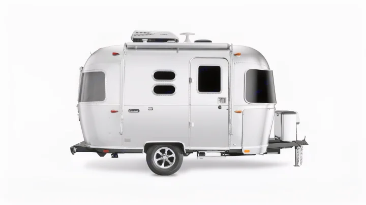 Iconic silver Airstream travel trailer on white, a classic recreational vehicle. Perfect for your next rv rental trip.. Airstream Caravel 2020
