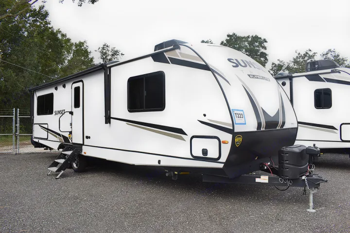 This white Sunset Super Lite travel trailer is available for RV rental.. Crossroads RV Sunset Trail Super Lite 2023