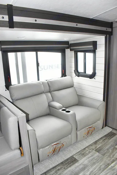 Premium RV rental interior: cozy gray recliners with cup holders, ample windows, and stylish shiplap walls.. Crossroads RV Sunset Trail Super Lite 2023