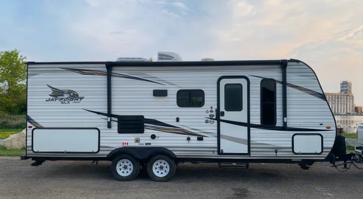 Jayco travel trailer RV rental parked outdoors, ready for your next adventure or camping trip.. Jayco Jay Flight SLX 2019