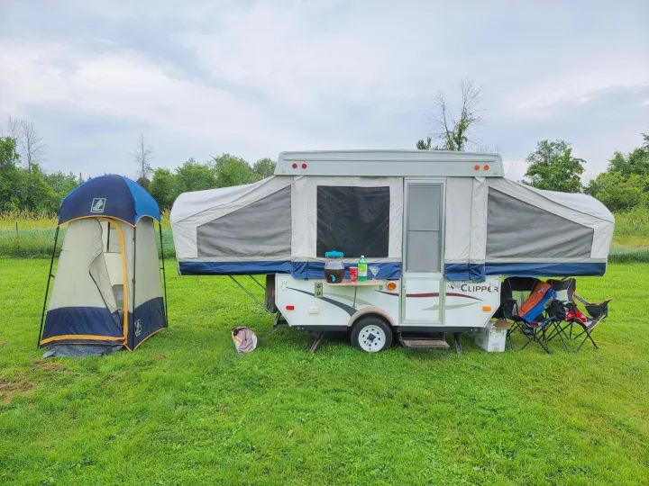 Picture of trailer and optional privacy tent with toilet.. Coachmen Clipper 2008