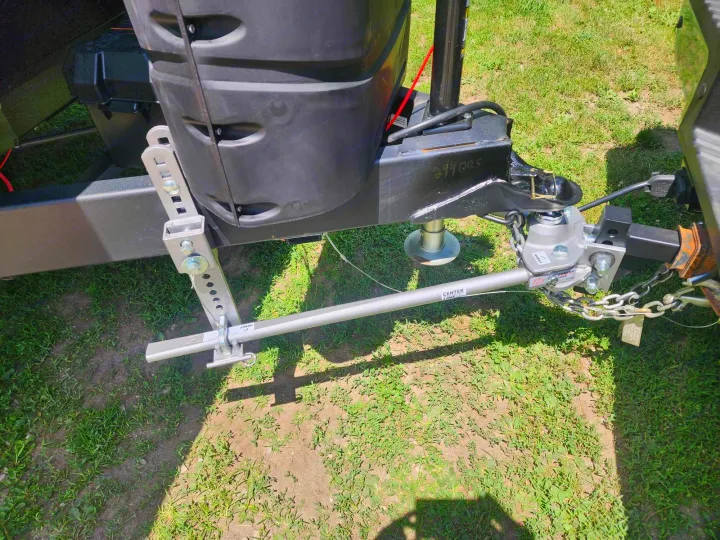 RV rental trailer's front hitch setup with a Husky weight distribution system, vital for safe, balanced towing.. Jayco Jay Flight 2023