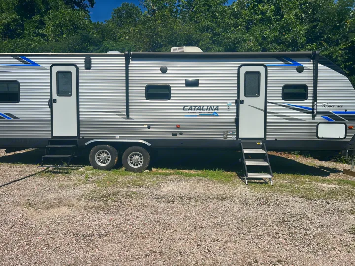 Spacious silver Coachmen Catalina travel trailer RV rental with two doors & steps. Ready for your next adventure.. Coachmen Catalina 2021