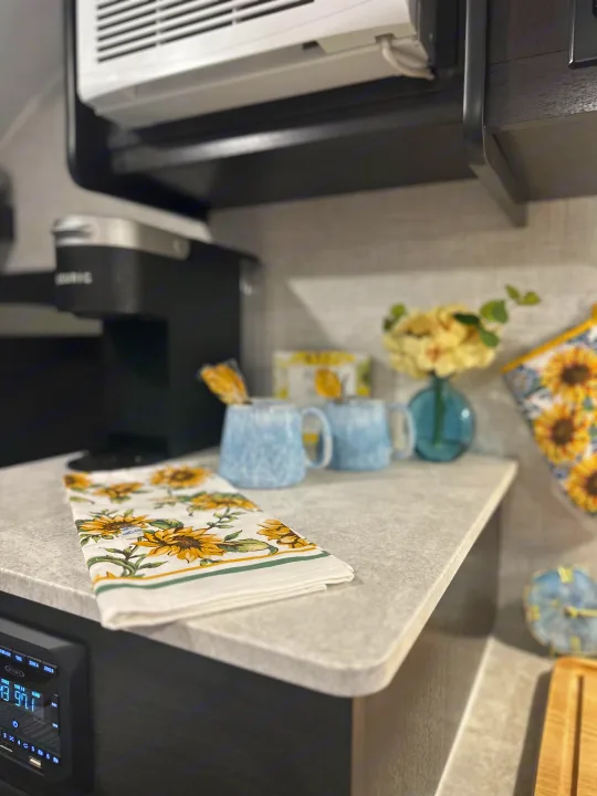 Enjoy amenities in your RV rental! A Keurig coffee station, sunflower decor, and FM stereo create a homey feel.. Braxton Creek Bushwhacker Plus 2021