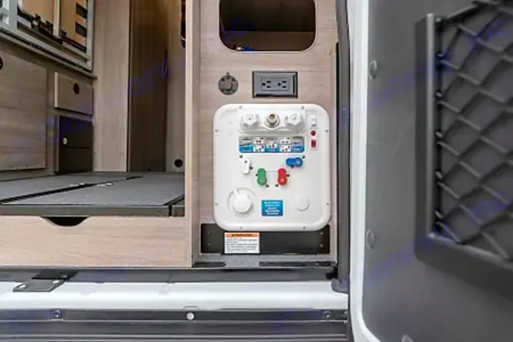 RV rental utility panel with water hookups & power outlet for convenient camper living.. Winnebago Solis PX 2024