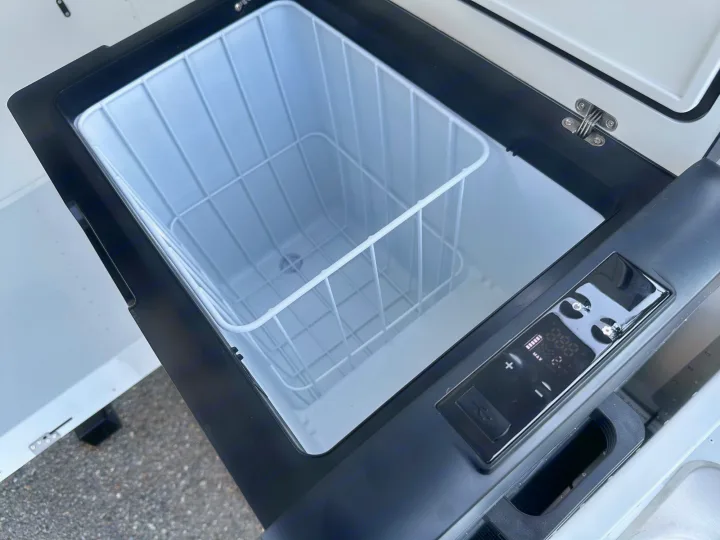 RV rental essential: Open portable fridge with wire basket and digital temperature control for your adventures.. Mammoth Overland Mammoth HV 2023