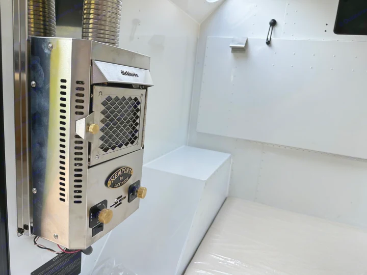 Cozy RV rental interior with a Newport by Dickinson heater for comfortable travel.. Mammoth Overland Mammoth HV 2023
