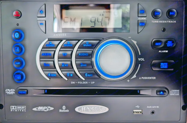 Jensen AWM968 RV multimedia stereo unit with blue backlit controls. Features include FM radio, DVD, USB, Bluetooth, ideal for an RV rental.. nuCamp T@G 2017