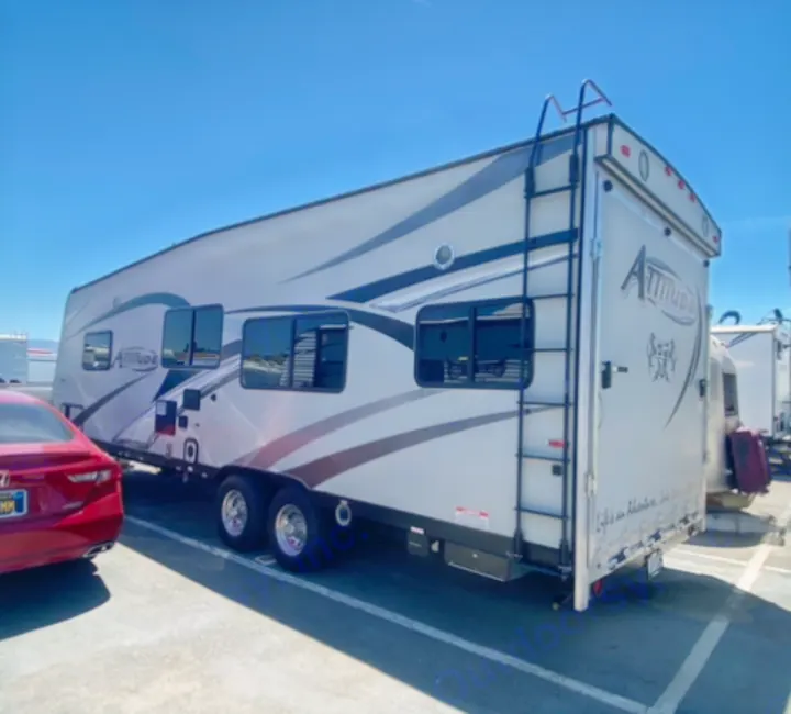 Spacious Attitude toy hauler RV rental parked on a sunny day, ready for adventure and outdoor recreation.. Eclipse Recreational Vehicles Attitude 2016