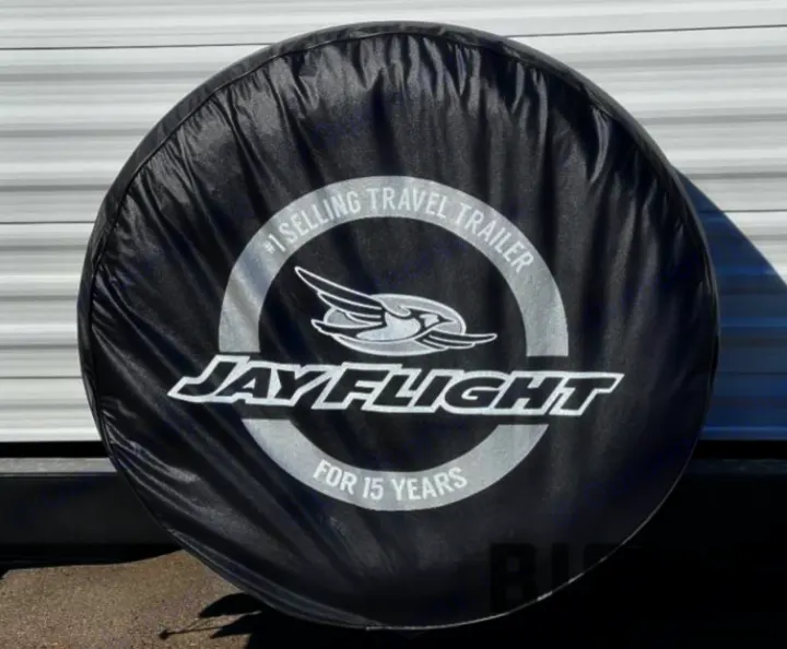 Black Jay Flight RV spare tire cover, marked "#1 selling travel trailer for 15 years," ready for rv rental.. Jayco Jay Flight SLX 2023