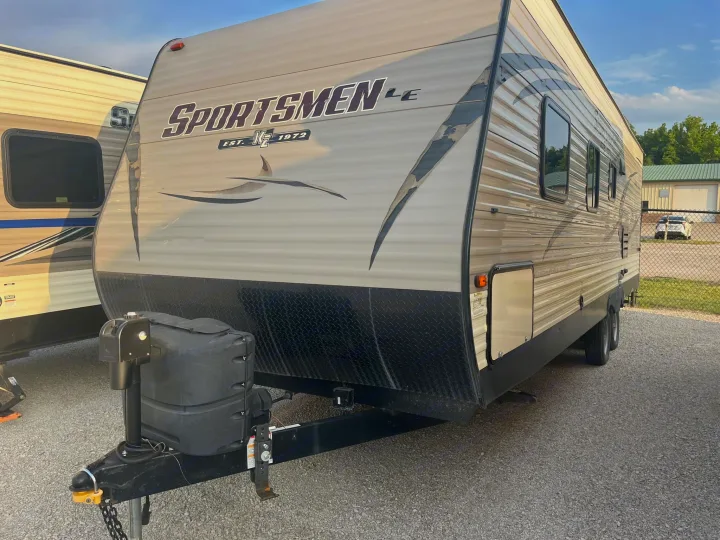 Explore this tan Sportsmen LE travel trailer, perfect for your next rv rental adventure. Features front hitch, propane, and windows.. Sportsmen LE 2018