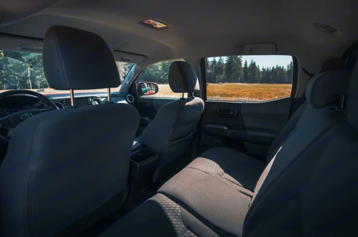 Step into this Toyota truck, perfect for an RV rental getaway. Spacious interior features seats, dash, and a beautiful outdoor view.. Toyota Tacoma 2023