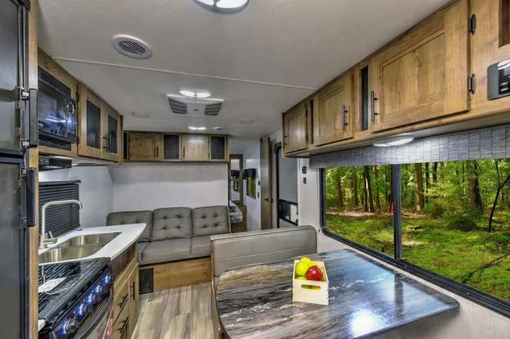 Beautiful dining area, table turns into full bed. Sofa is also a pull out bed!. Heartland RVs Pioneer 2023