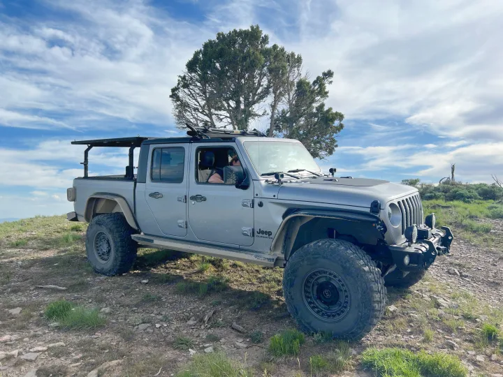 Grey Jeep Gladiator, equipped for rugged trails. Explore beyond traditional RV rentals with this off-road beast!. Jeep Gladiator 2020